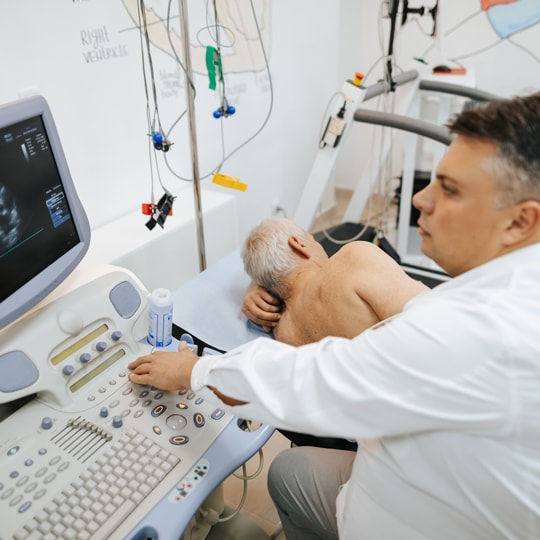 Specialist performing Musculoskeletal Examination on elderly client